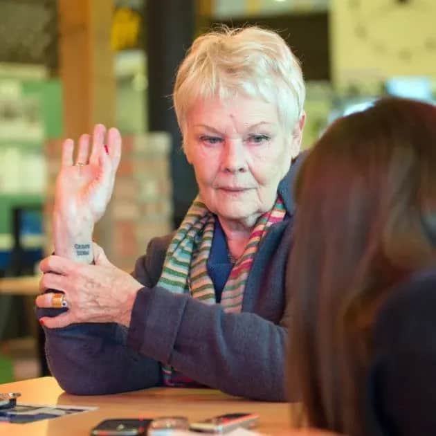 Judi-Dench-Carpe-Diem-tattoo.-Photo-credit-Andy-Newbold