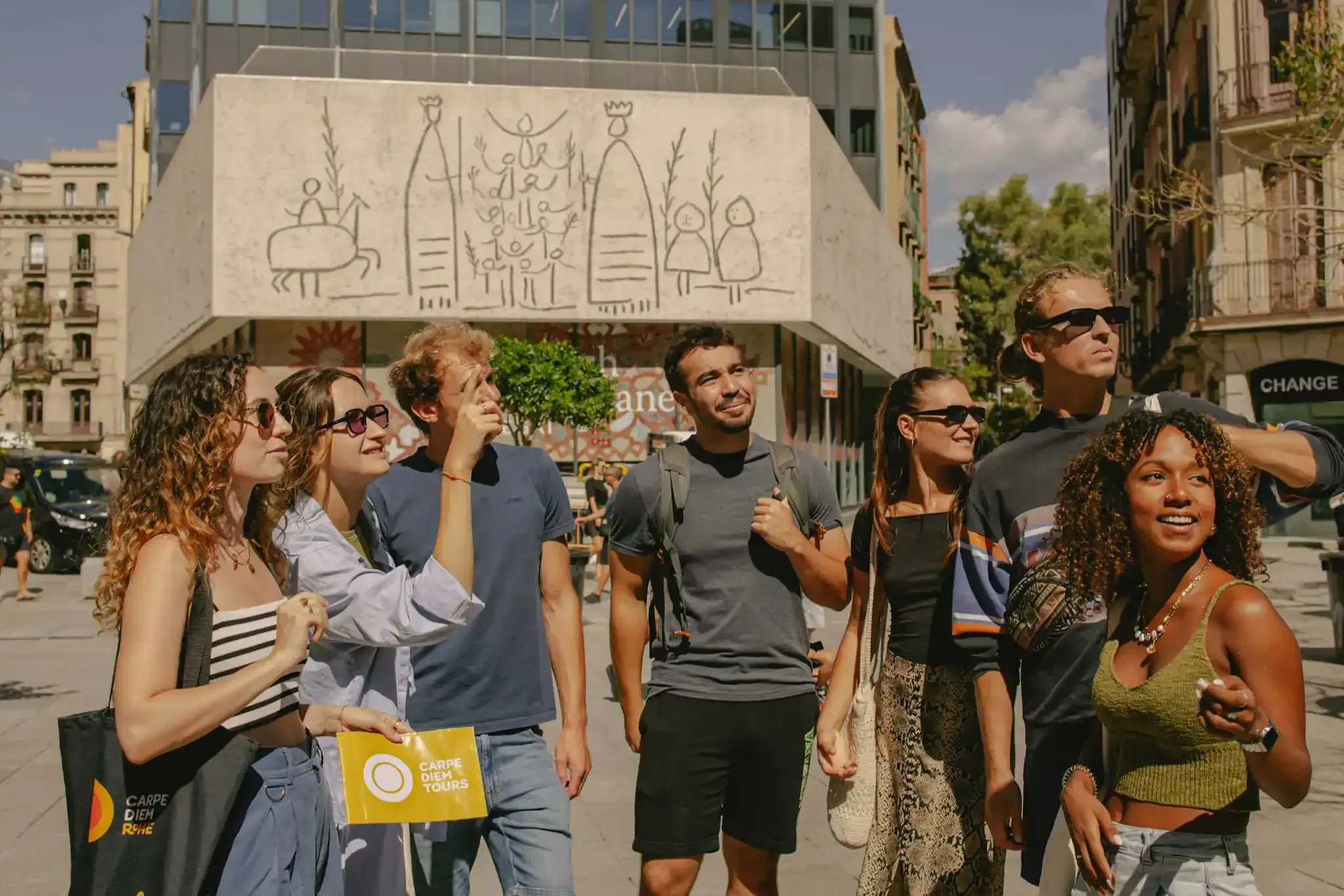 Tour group posing for a photo on a Carpe Diem walking tour in Barcelona