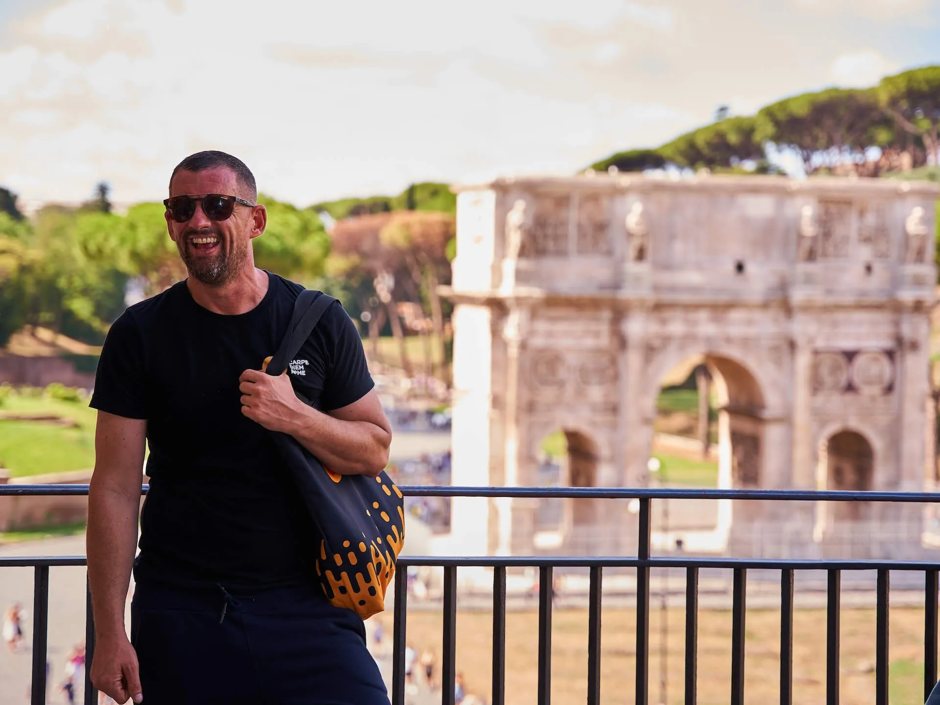 Colin-standing-in-the-Colosseum-in-front-of-the-Arch-of-Constantine