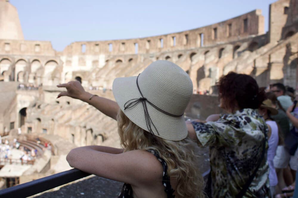 Private Colosseum tour guide pointing to the emperor's box