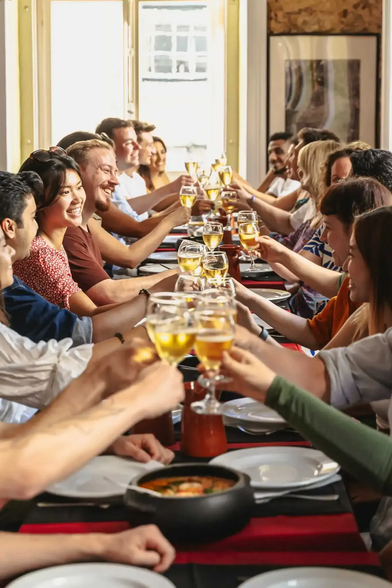 Group toasting with drinks during a Carpe Diem Lisbon food tour