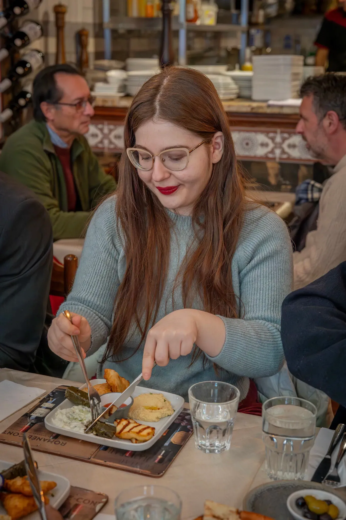 Girl is eating on the london food tour