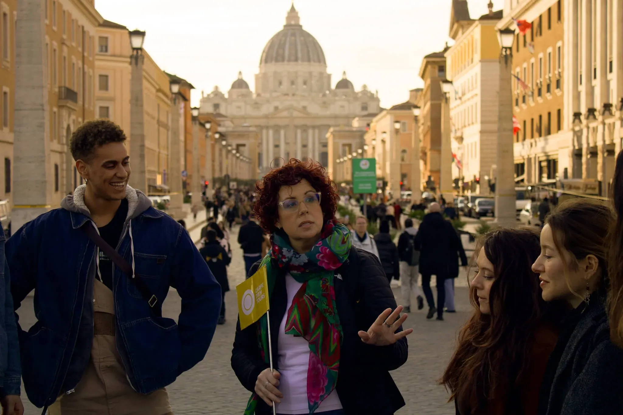 Tourists exploring grand historic Roman train station or public building with ornate architecture during Carpe Diem Tours