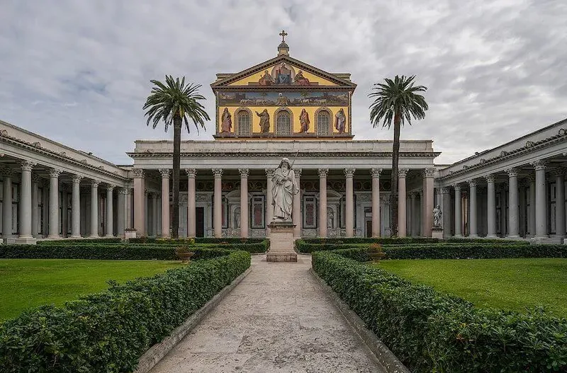 Basilica of St Paul Outside the Walls papal basilica exterior with colonnade showcasing ancient Roman Catholic architecture and religious pilgrimage sites featured in Carpe Diem Tours Rome historical exploration and Vatican educational experiences