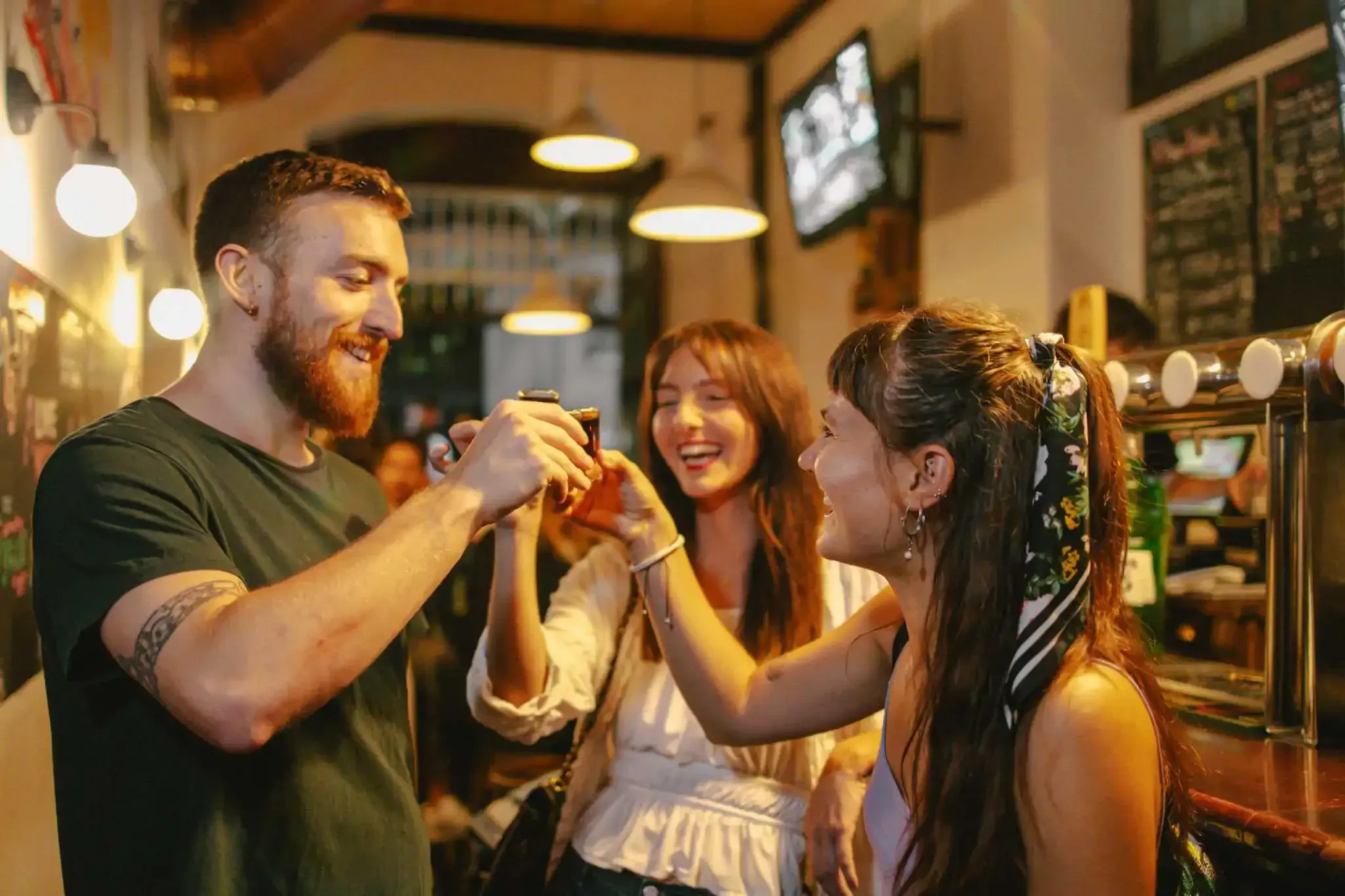 Group enjoying drinks and toasting during a Carpe Diem Barcelona Tipsy Tour