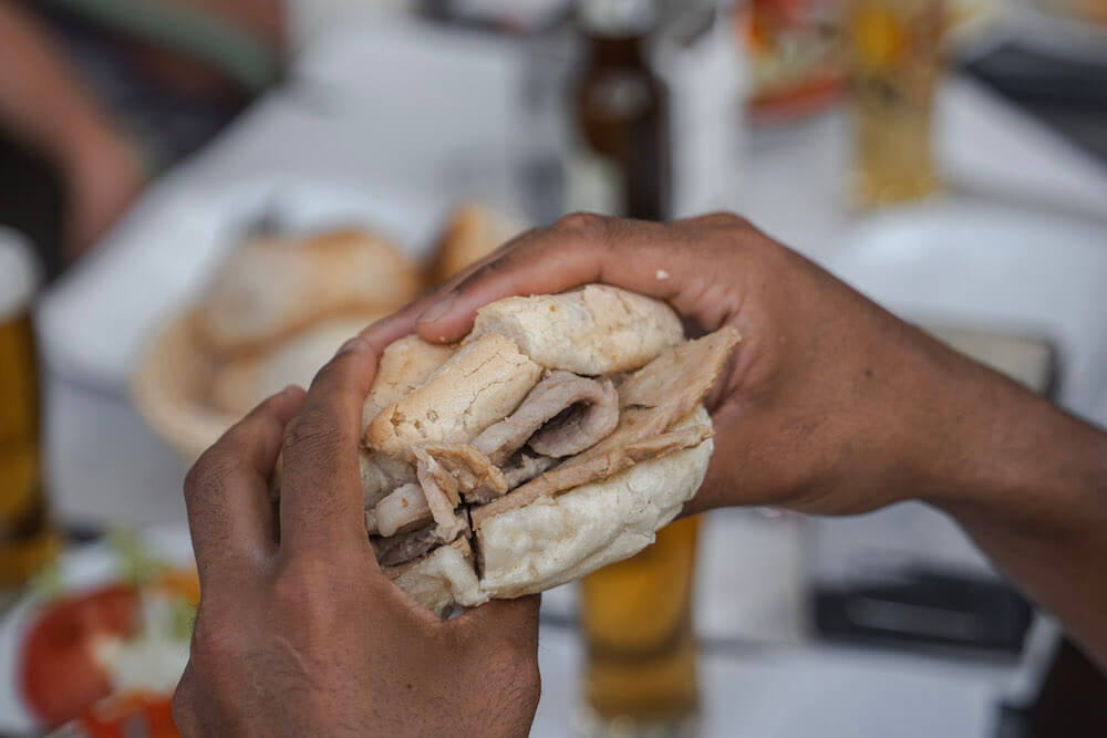 Close-up of a bifana sandwich