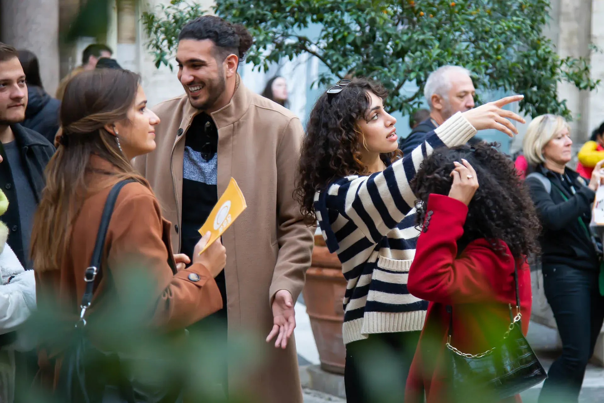 Happy group of tourists enjoying guided sightseeing experience during Carpe Diem Tours Rome walking tour with professional guide