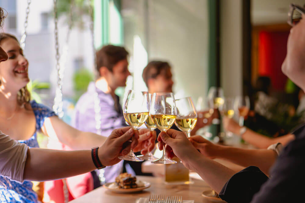 Enjoying a glass of wine with others over Friendsgiving in Rome