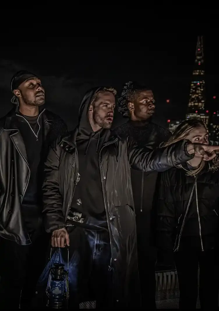 London Ghost Tour guide is holding a lapm