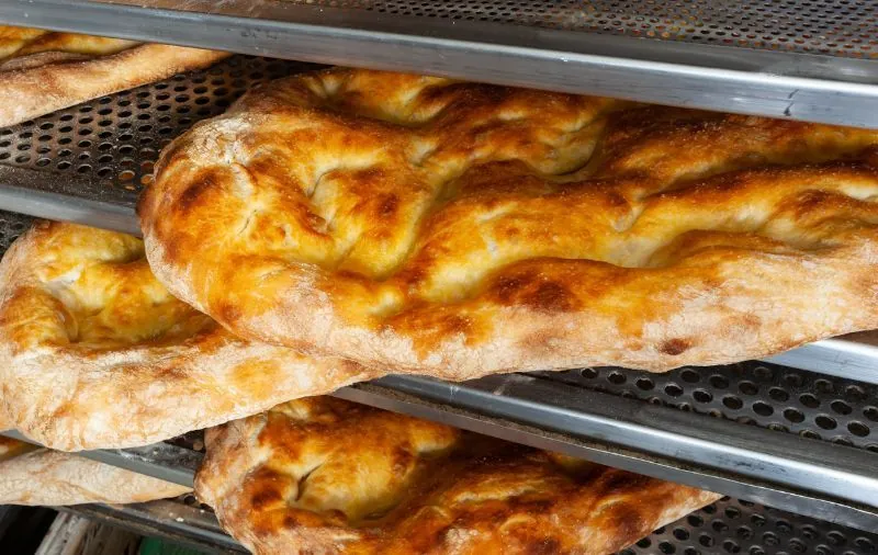 Pieces of freshly baked Schiacciata, a traditional Tuscan flatbread