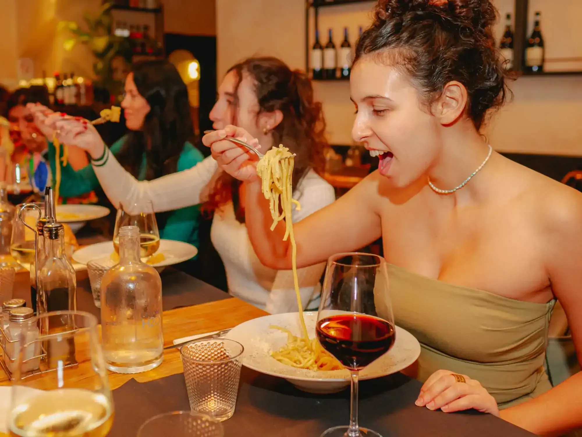 Cover image for Trastevere Rome food tour featuring tourists enjoying authentic Italian cuisine and wine during Carpe Diem Tours culinary experience