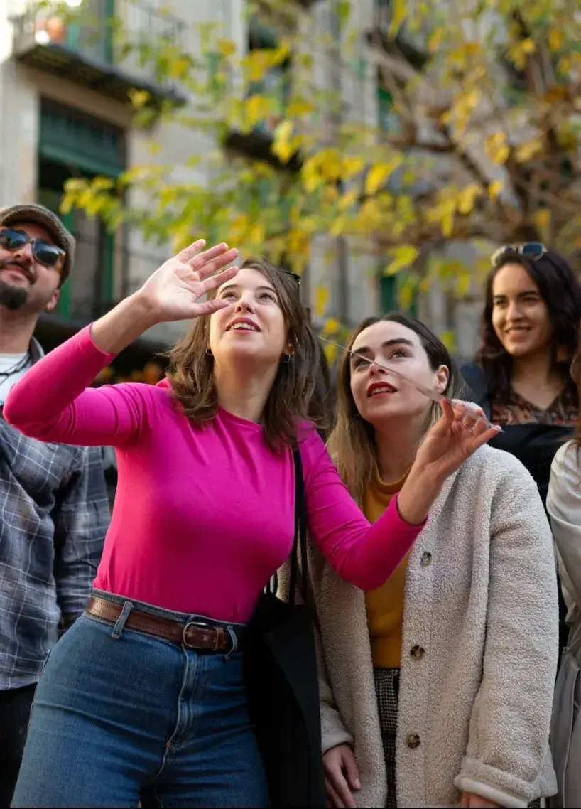Local guide sharing stories on Barcelona food tour