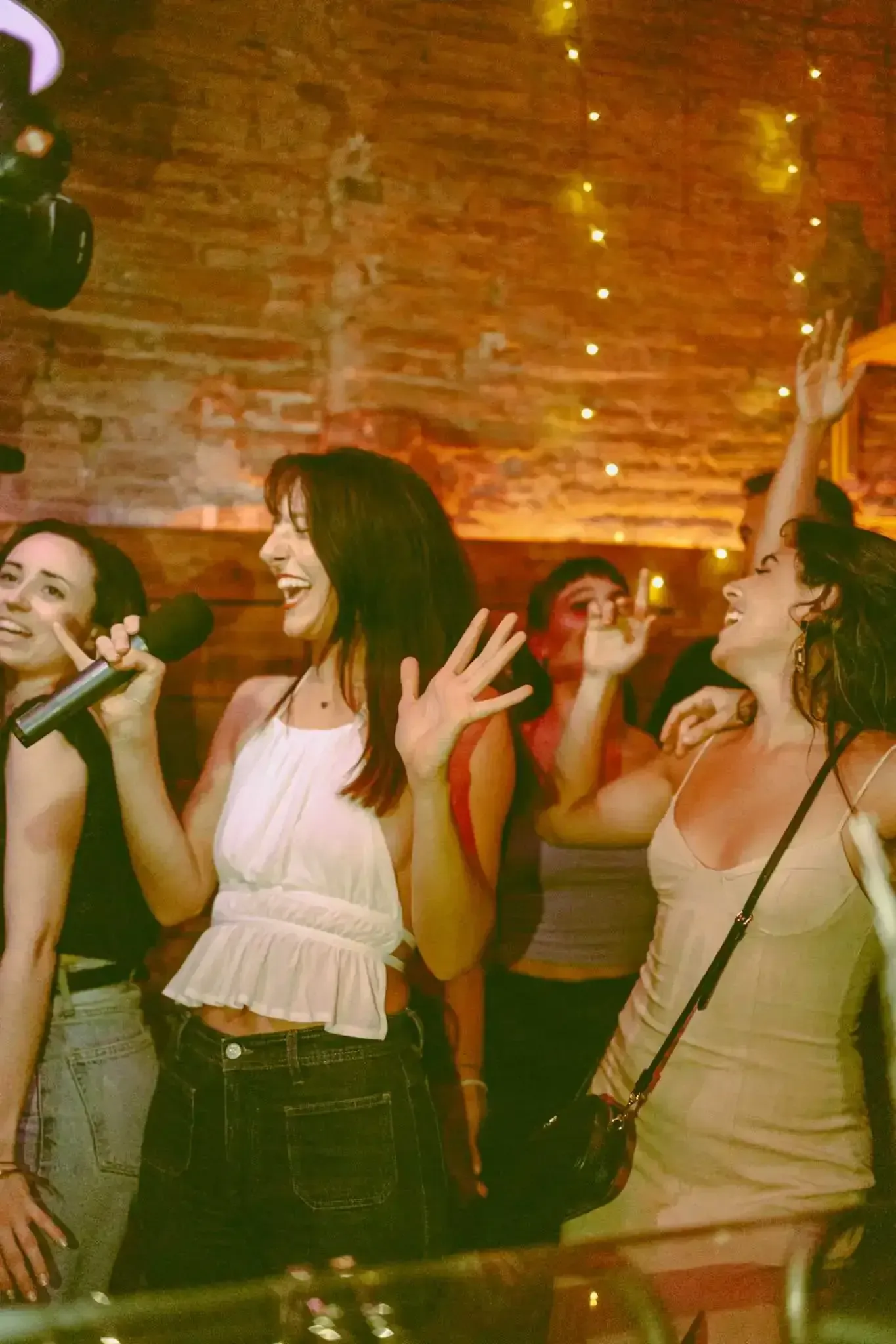 Travelers enjoying drinks and socializing on Barcelona tipsy tour