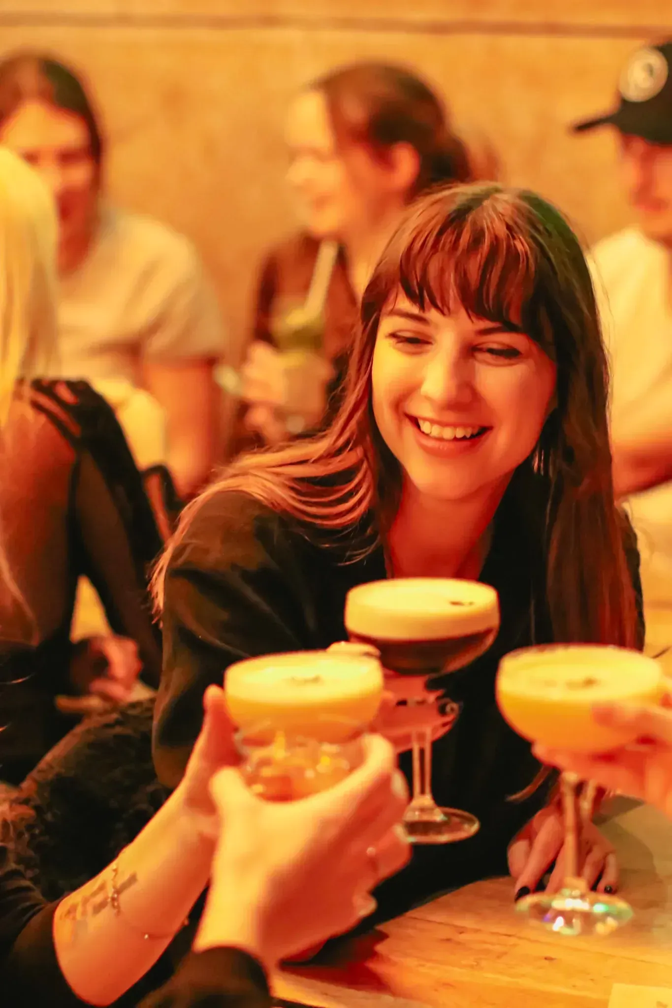 Travelers enjoying drinks at bar during Budapest tipsy tour