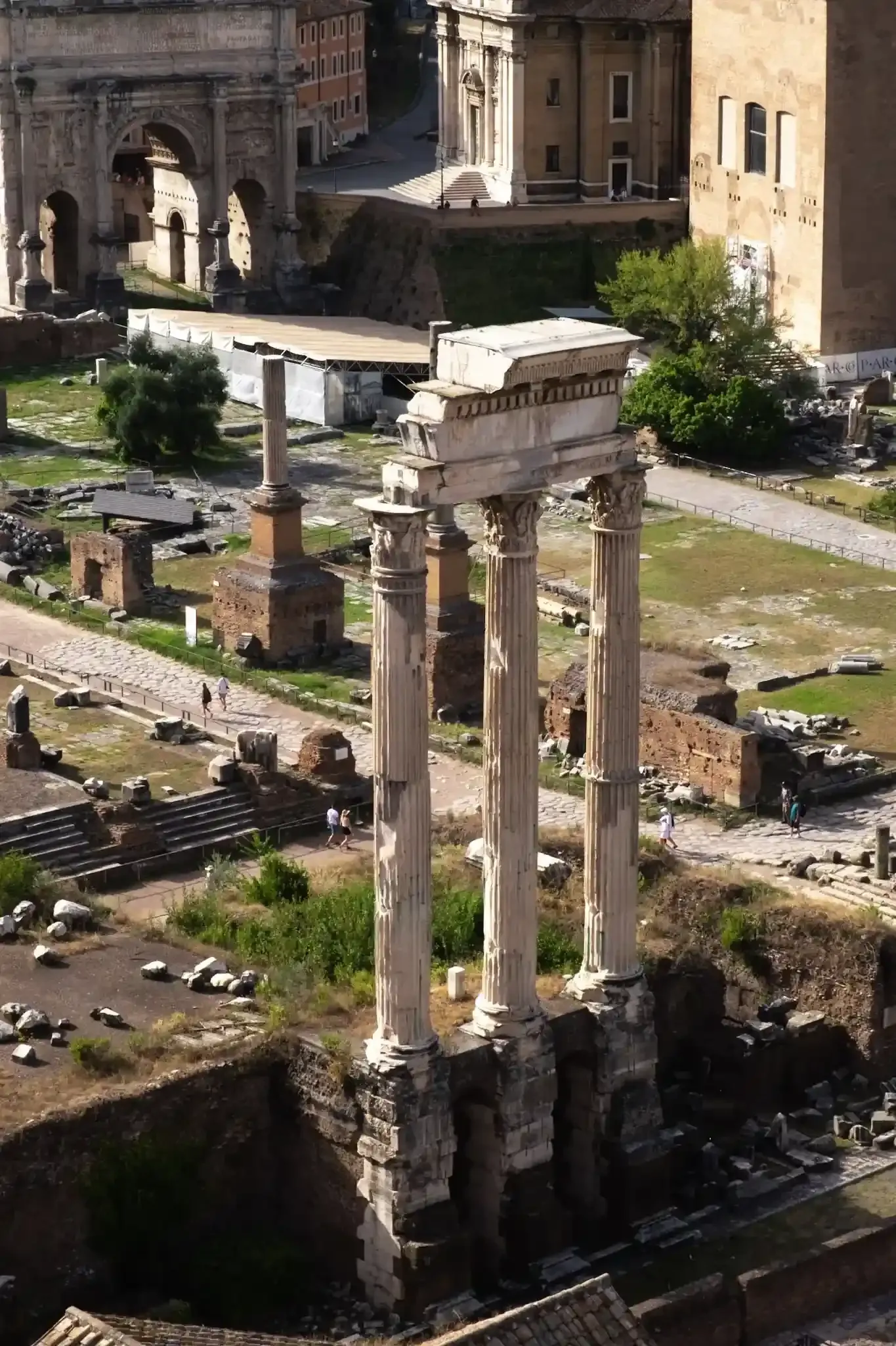 Arena floor tour participants exploring Palatine Hill ruins after Colosseum visit