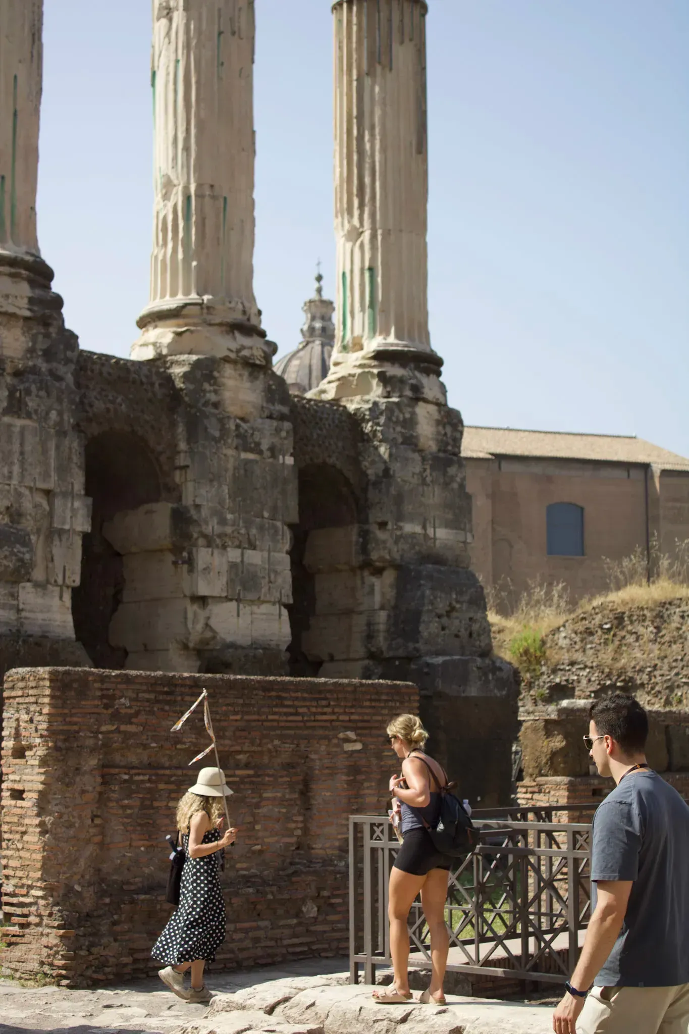 Standing on the site of Julius Caesar's temple in the Roman Forum on our Colosseum, Palatine Hill and Roman Forum tour