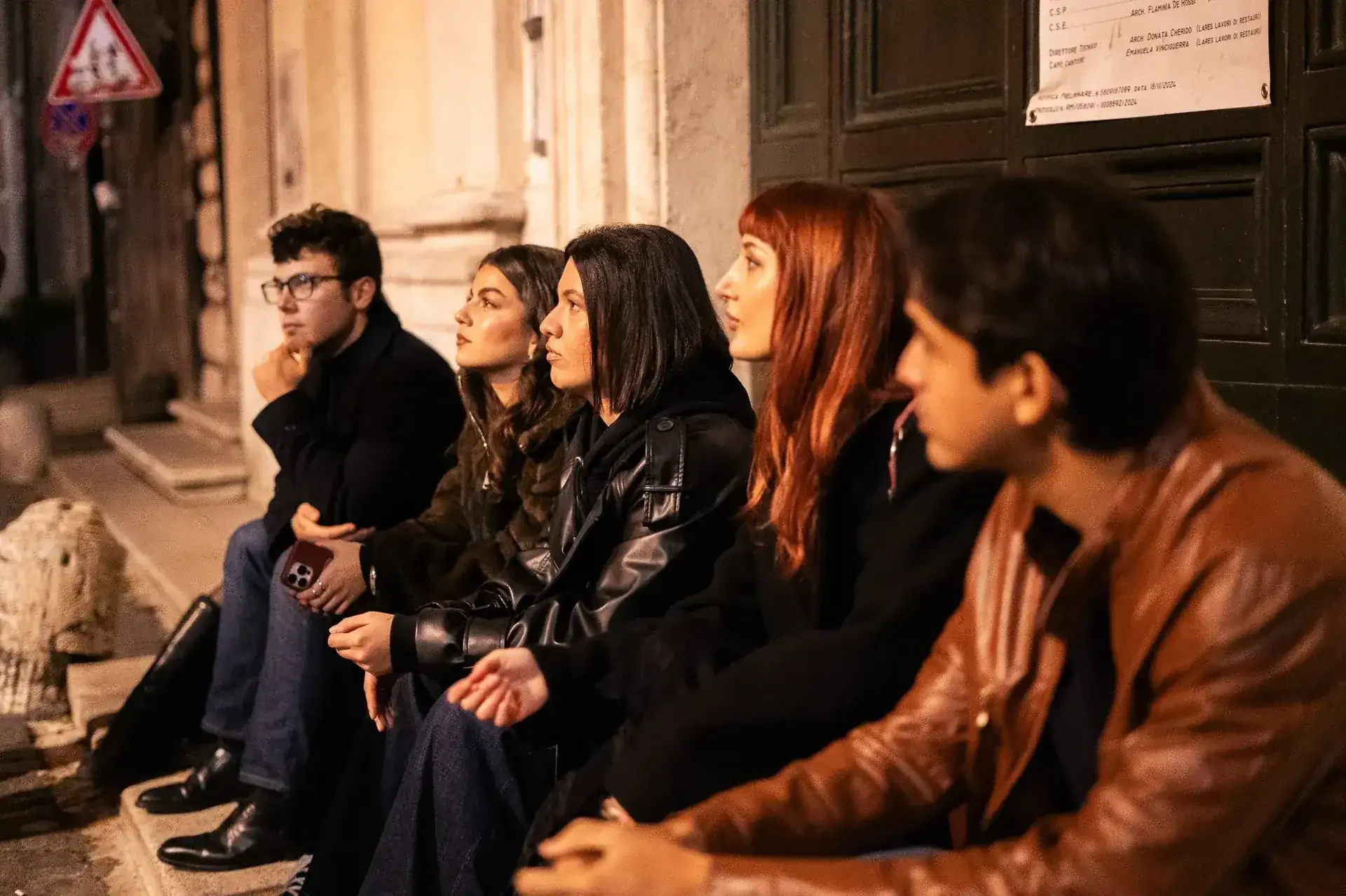 Audience intently listening to ghost stories during Rome night ghost tour