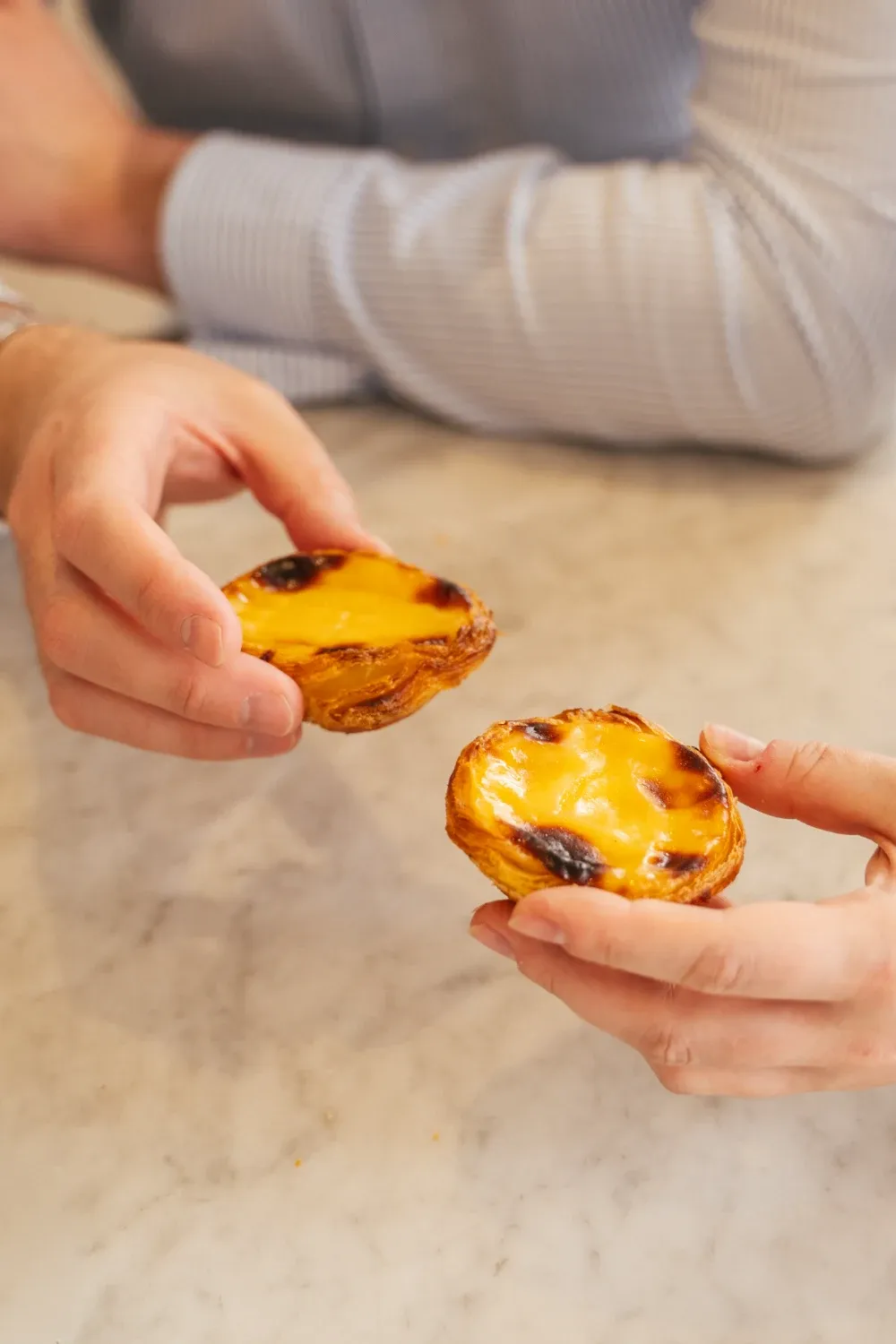 Plates of pastel de nata served at Fábrica da Nata during the Lisbon Food Tour