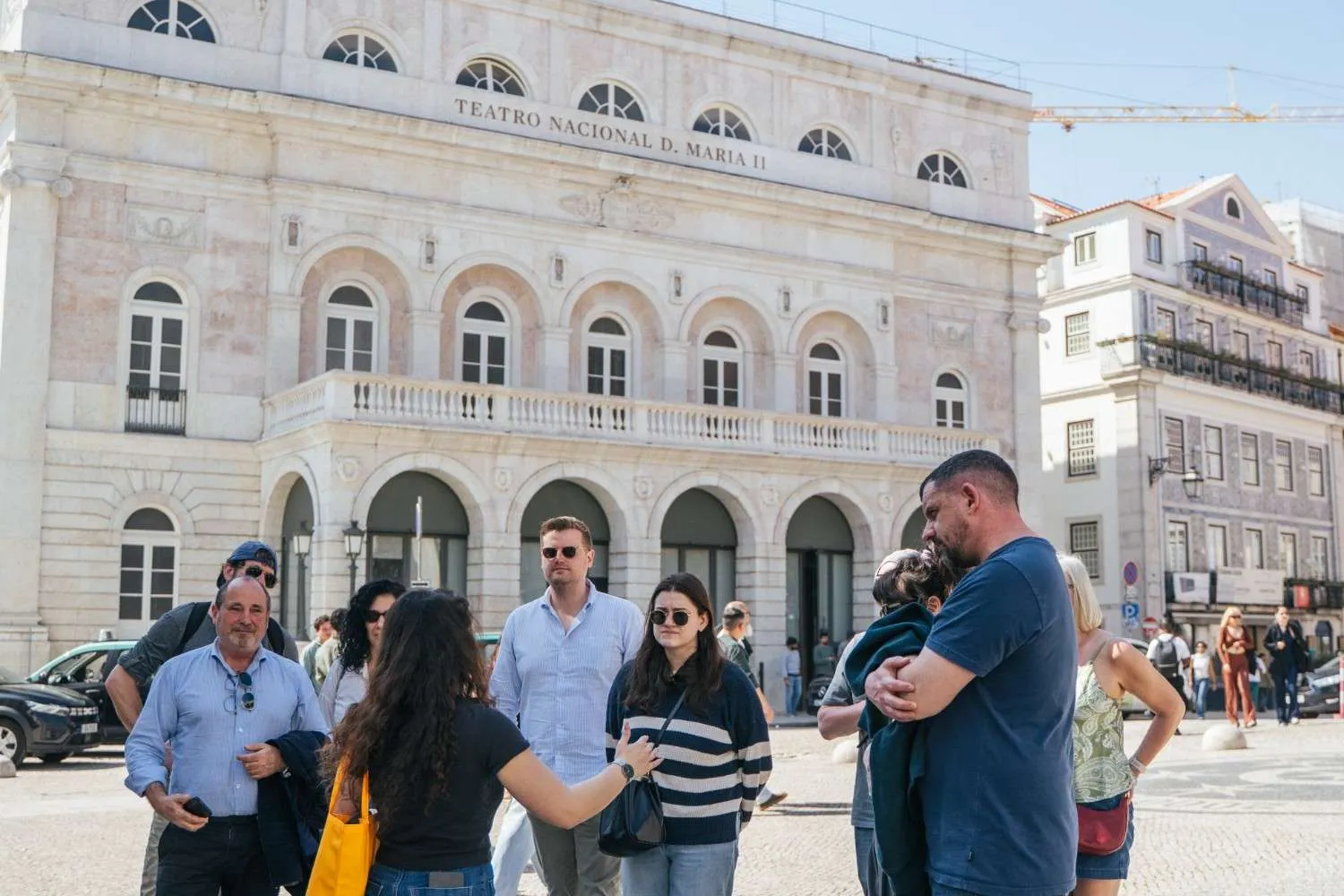 Lisbon Food Tour group gathered in front of Teatro Nacional D. Maria II in Rossio Square