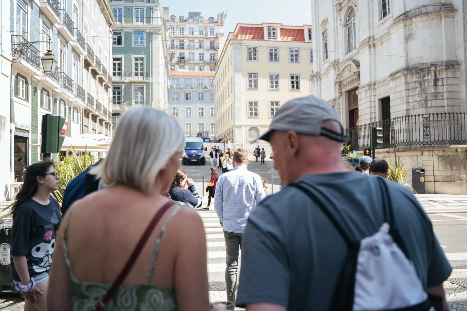 Small group walking through the Baixa neighbourhood on a Lisbon Food Tour