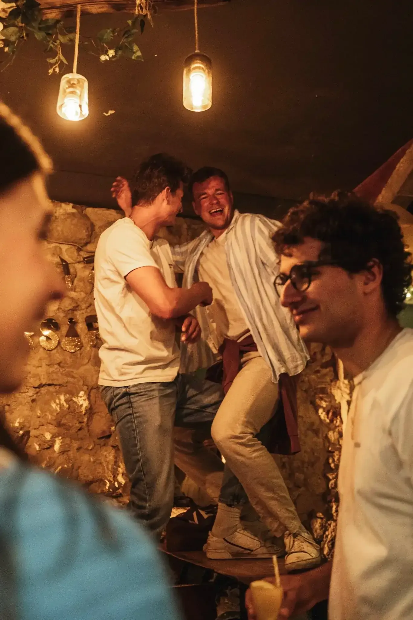 Group celebration with drinks during Lisbon nightlife tour