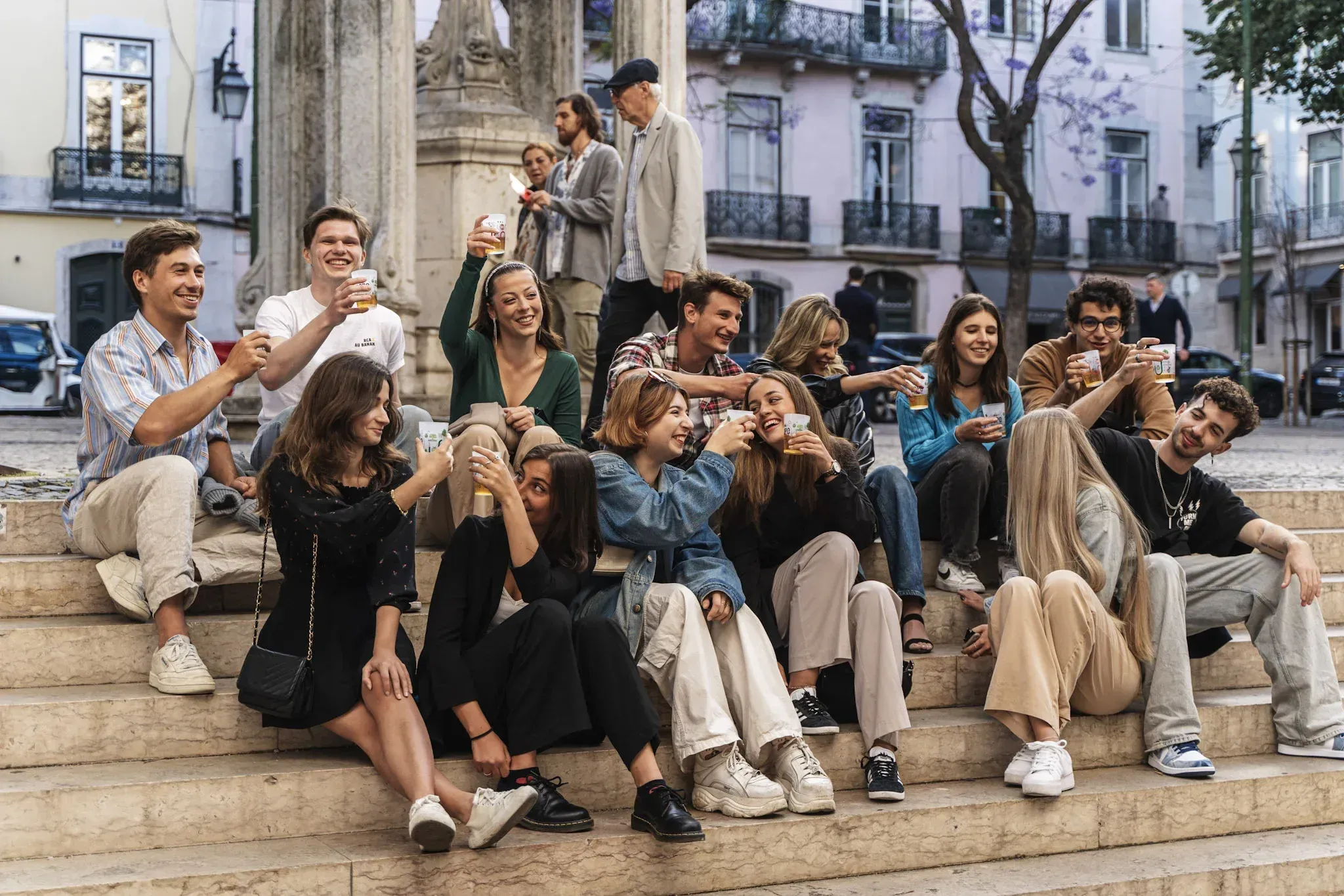 Group posing on steps during a Carpe Diem Lisbon Tipsy Tour