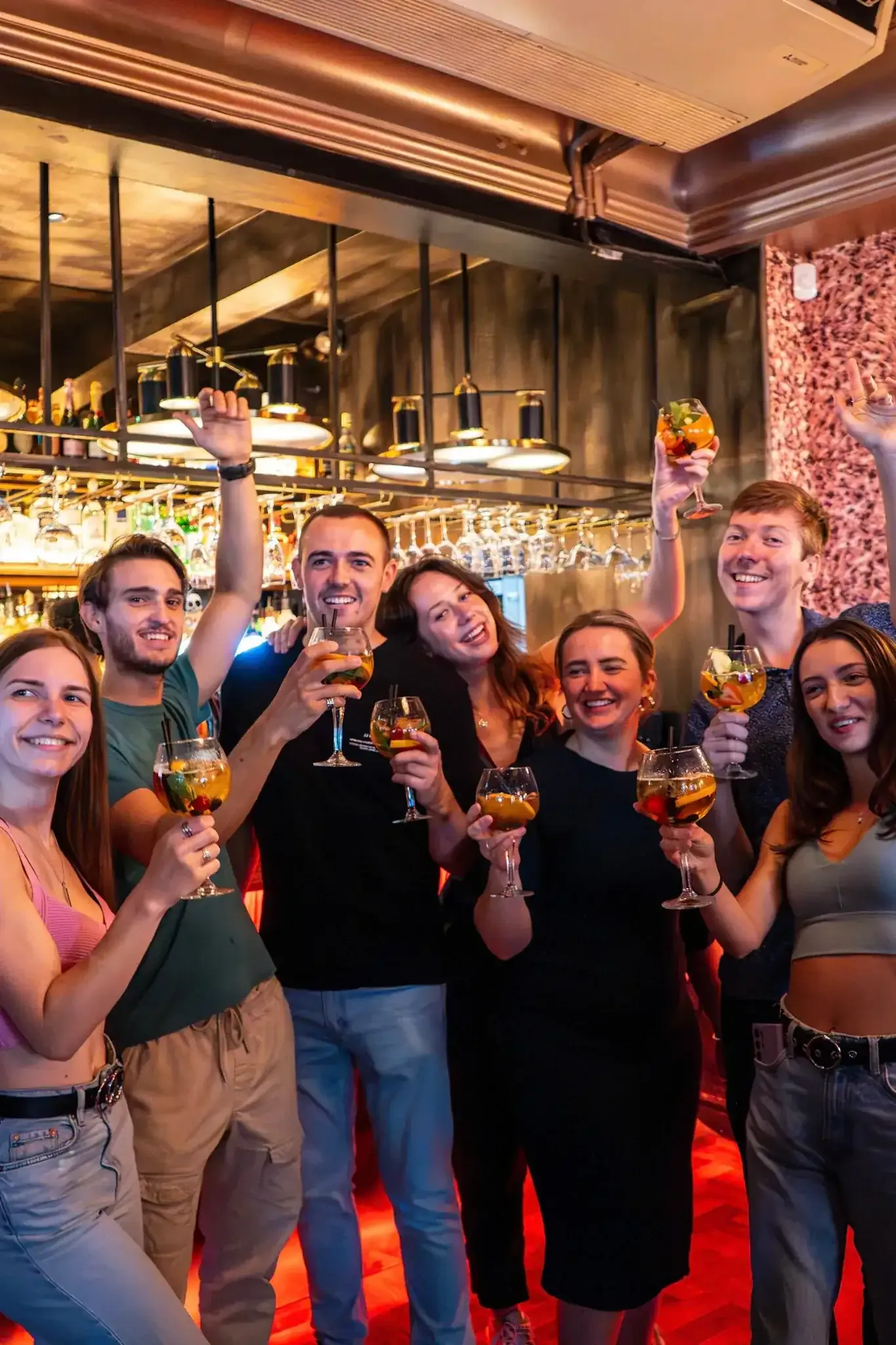 Travelers toasting with drinks on Lisbon tipsy tour