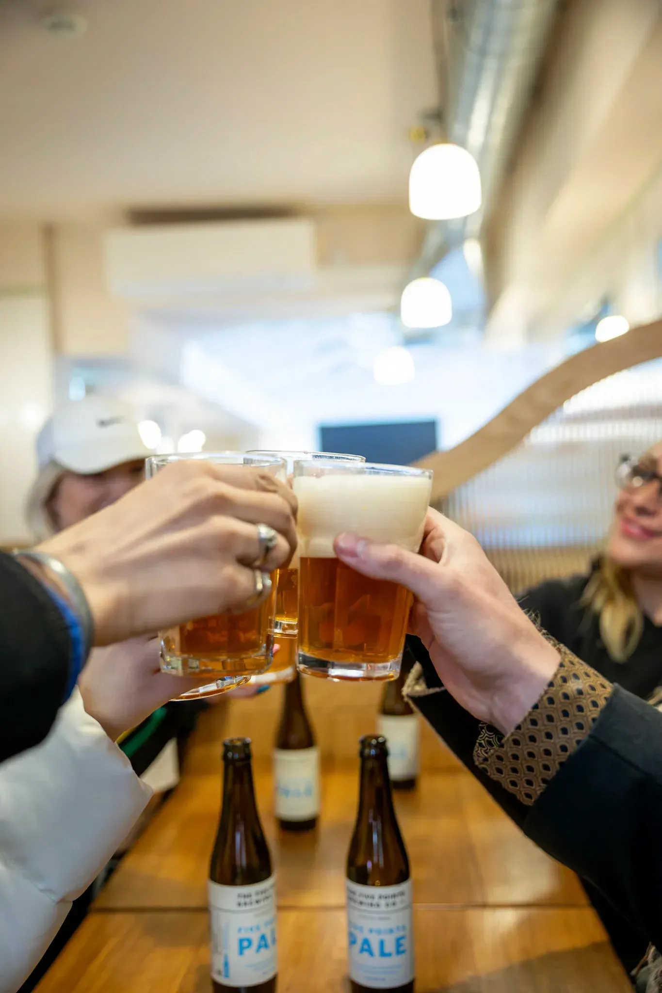 Happy group of tourists toasting with drinks during Carpe Diem Tours London food tour culinary experience and social dining adventure exploring British cuisine