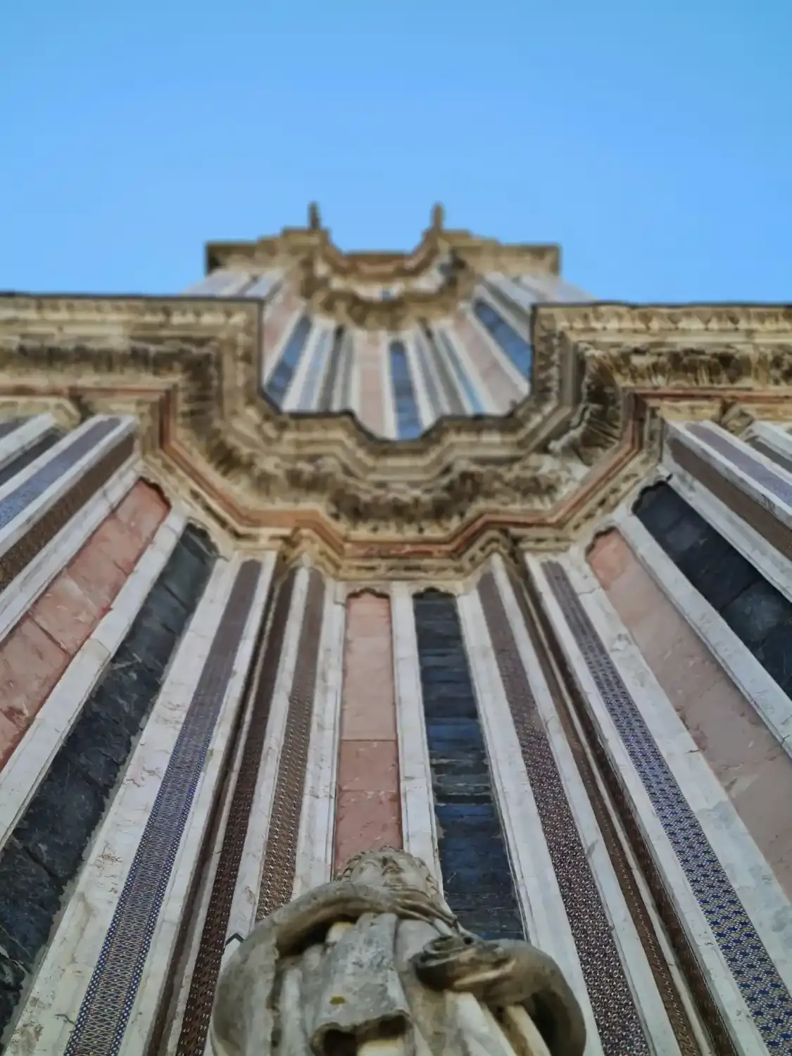 Orvieto Cathedral facade with ornate striped marble architecture shell motif and detailed sculptural elements