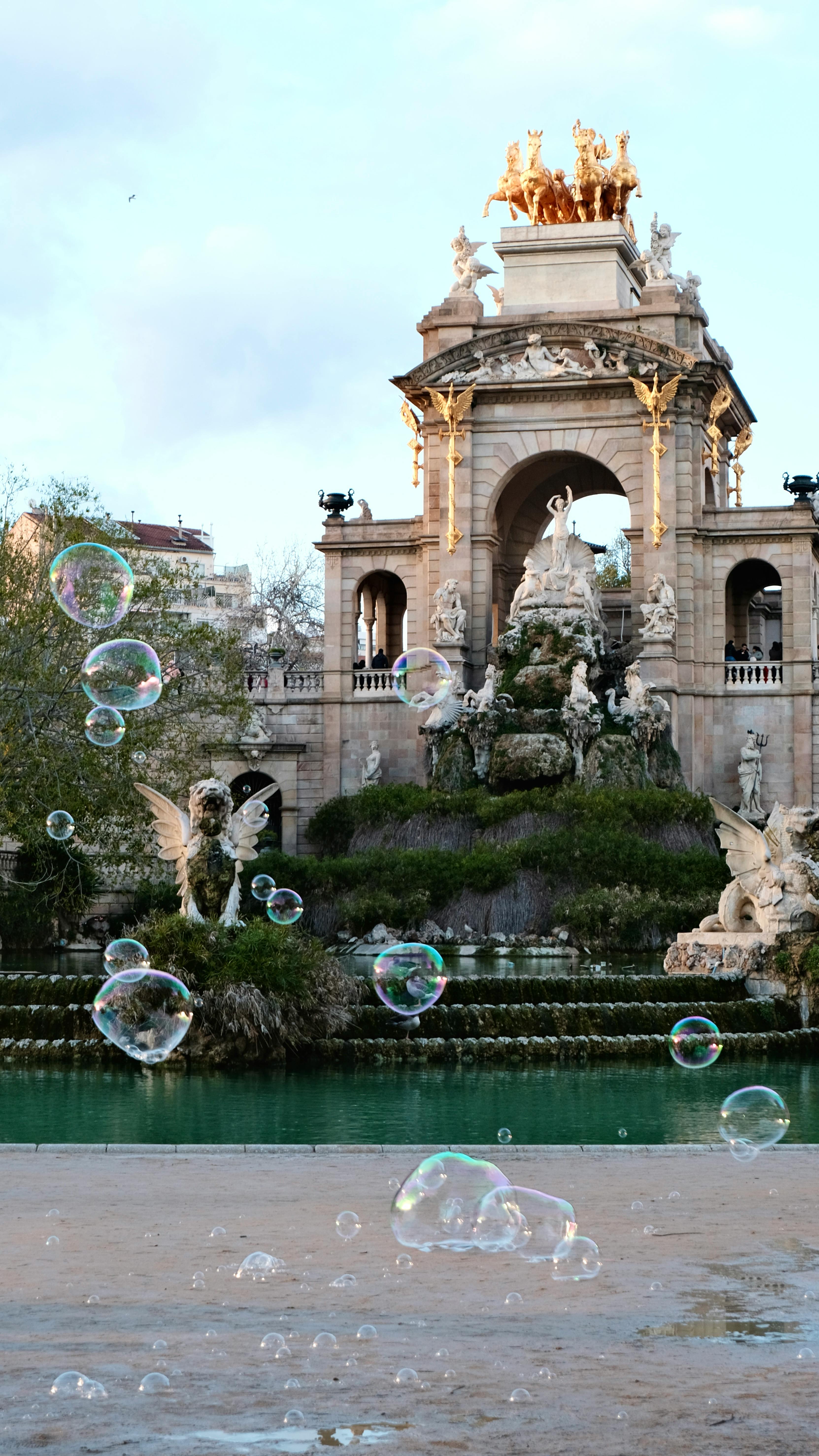 Bubbles being blown in front of the fountain at Barcelona's Parc Ciutadella