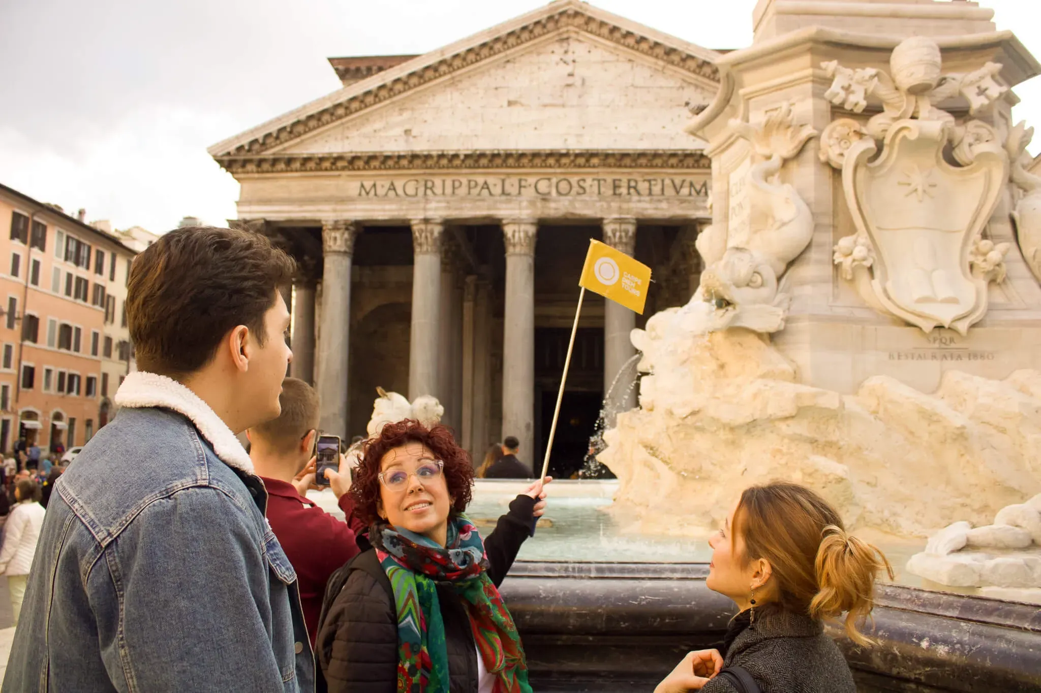 Professional tour guide leading group of tourists at the Pantheon in Rome during Carpe Diem Tours walking tour experience