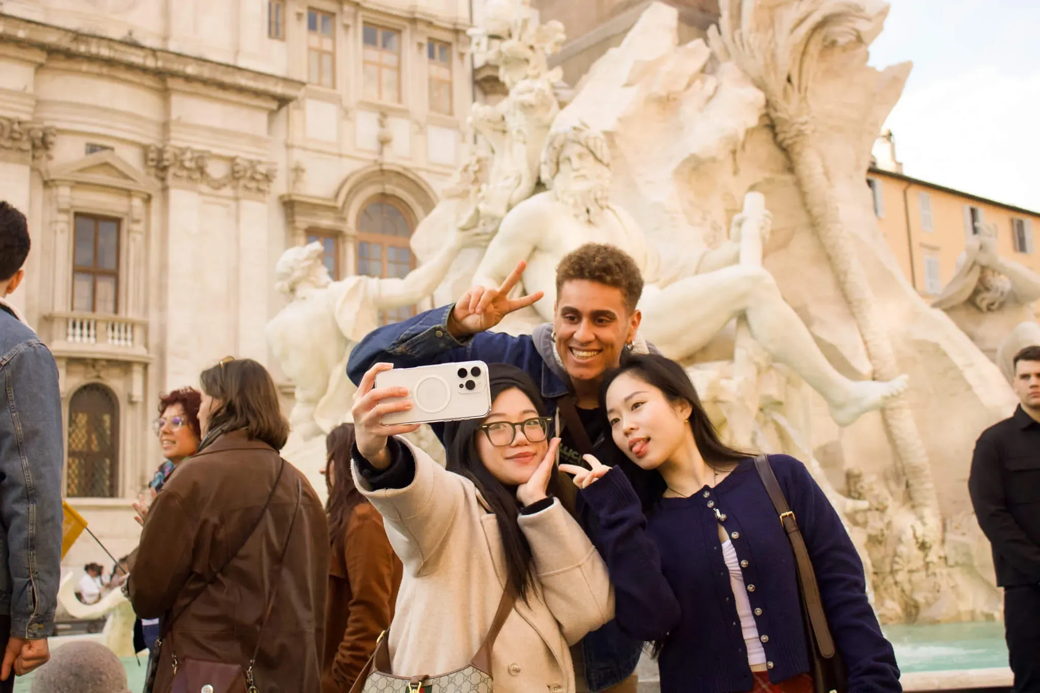 Group of happy tourists taking selfie at famous Roman landmark during Carpe Diem Tours guided sightseeing experience