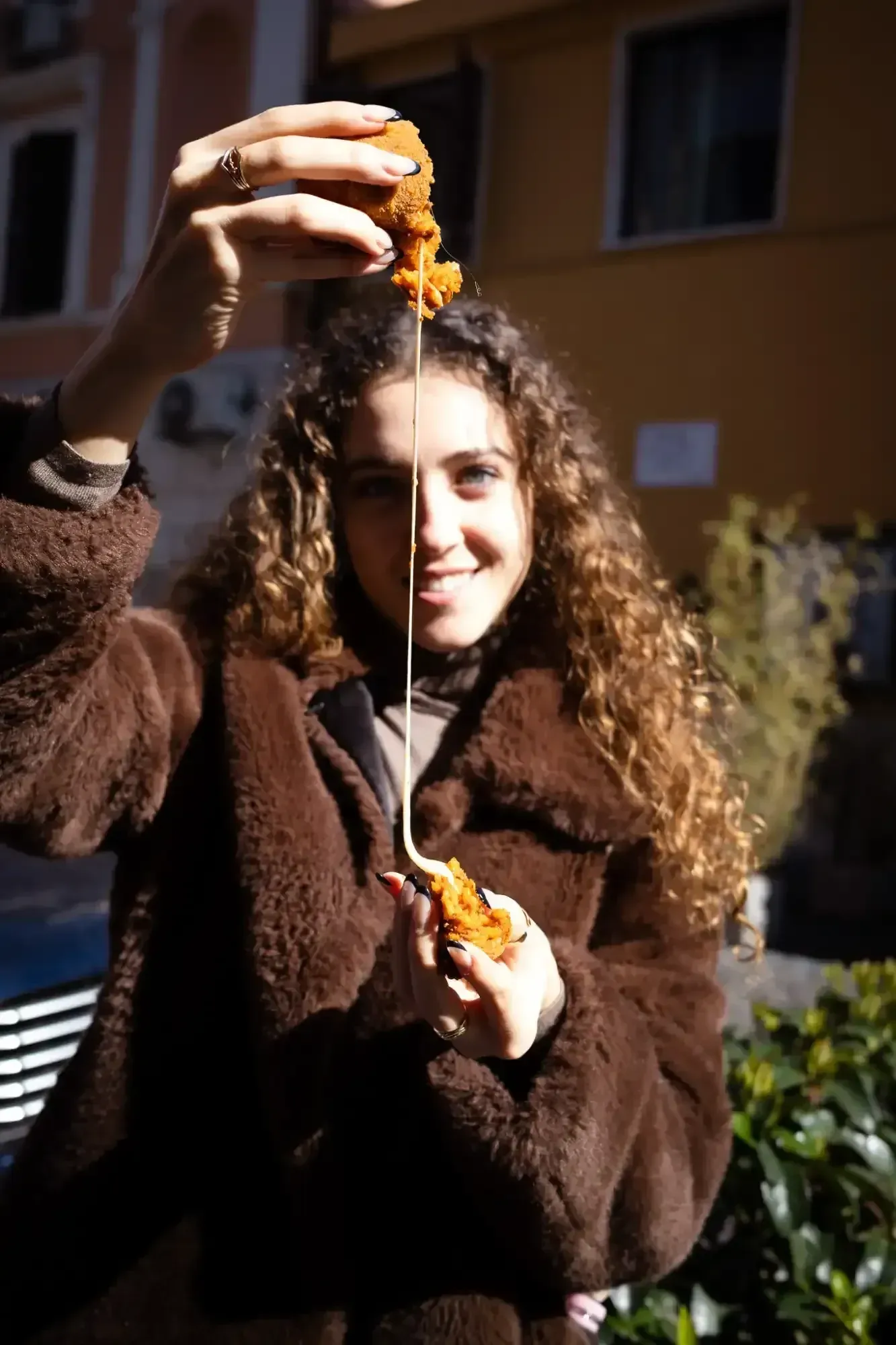 Food tour guide presenting traditional cheese platter at start of Rome Food Tour