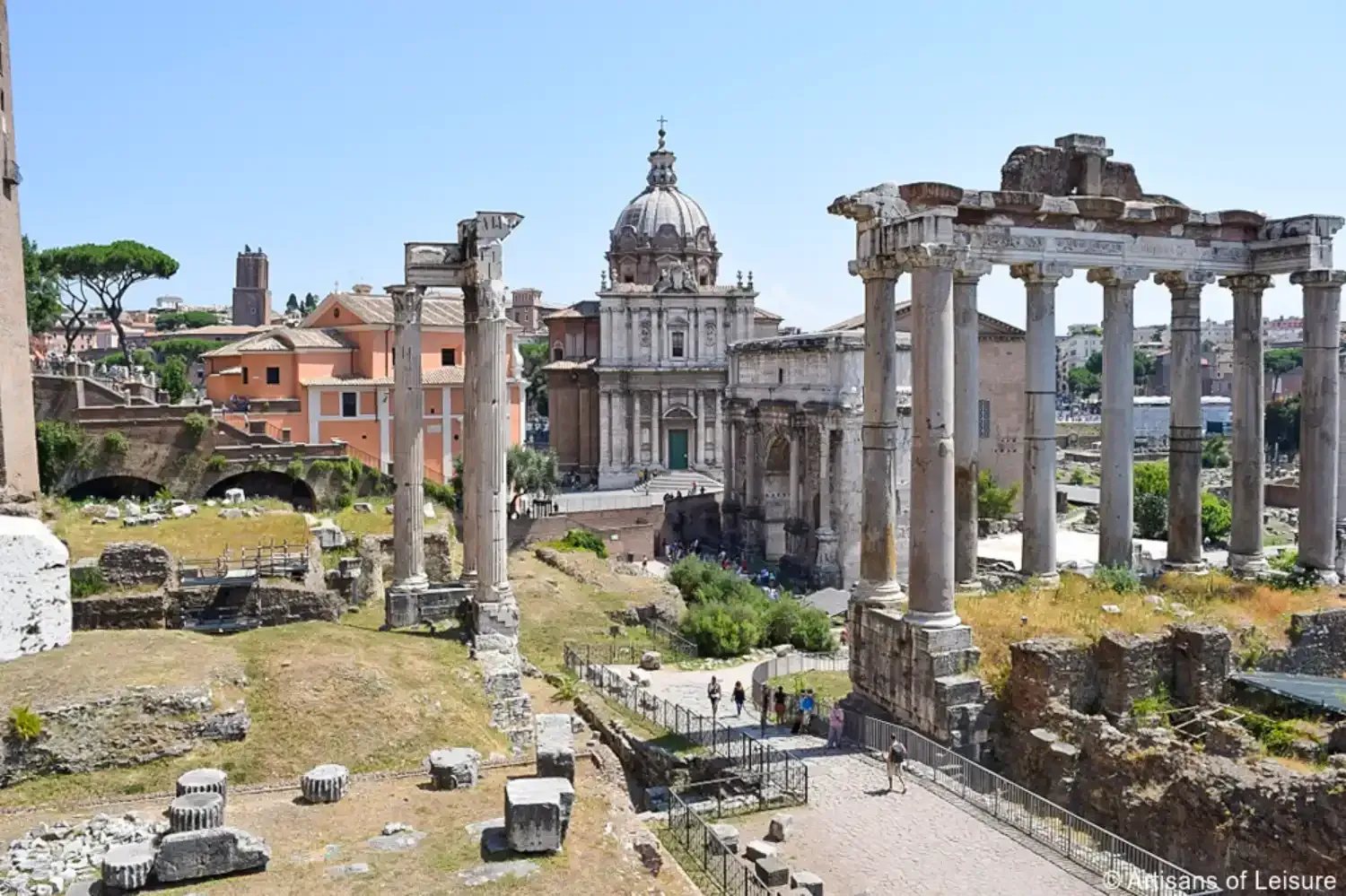 Roman Forum archaeological site with ancient temple columns, historical ruins, and daylight views