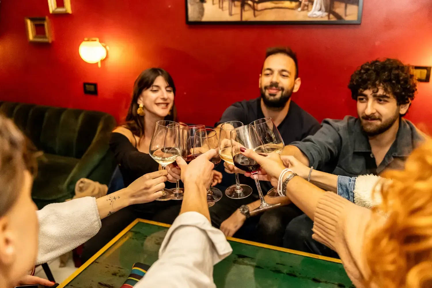 Couple toasting with wine glasses during romantic Rome Tipsy Tour