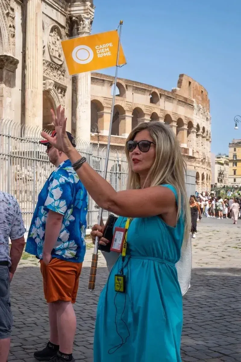 Expert guide leading small group through the iconic Colosseum amphitheater
