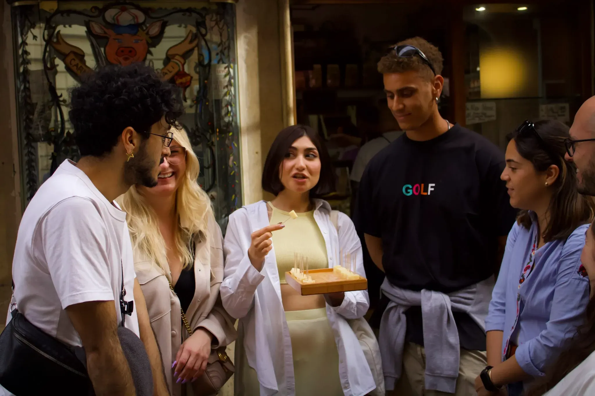 Group of food tour participants enjoying Spanish tapas and local cuisine during Spanish Rome Food Tour