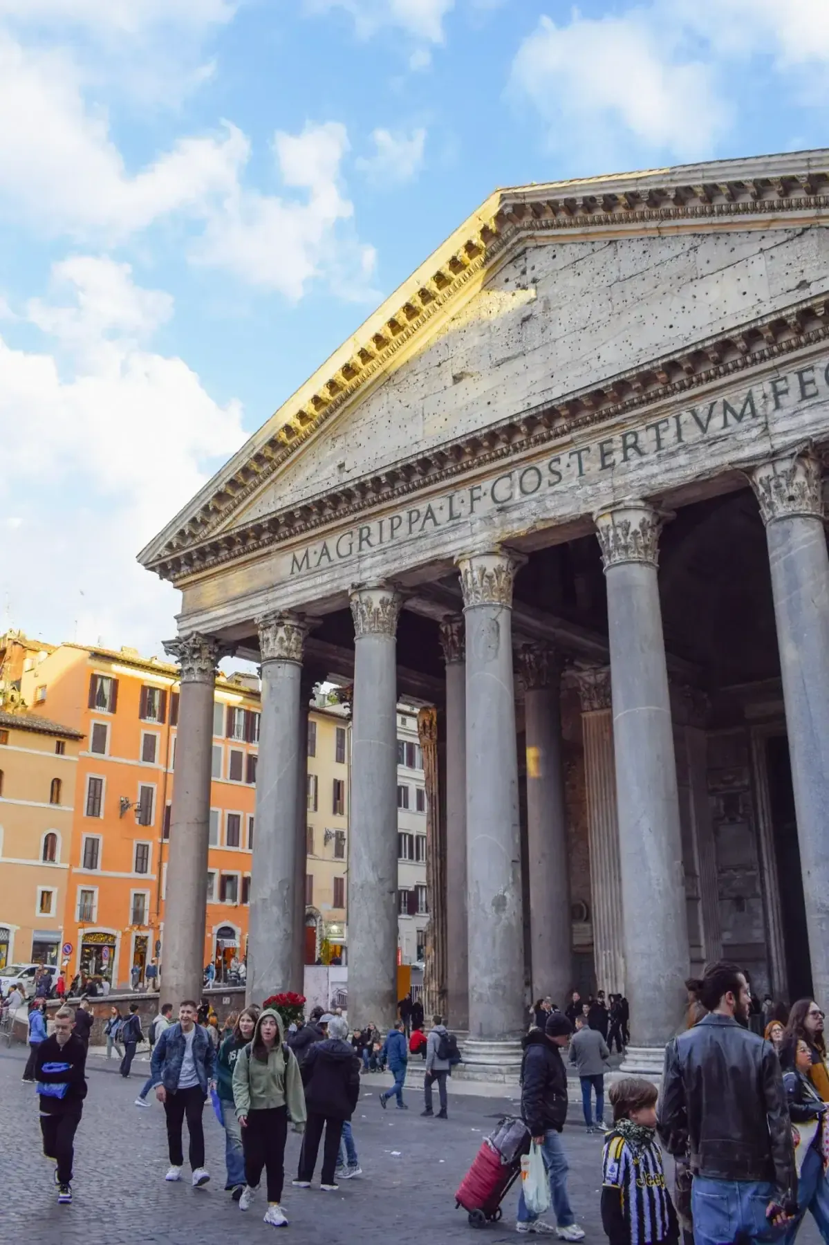 Small group of travelers on Spanish Rome walking tour exploring historic sites