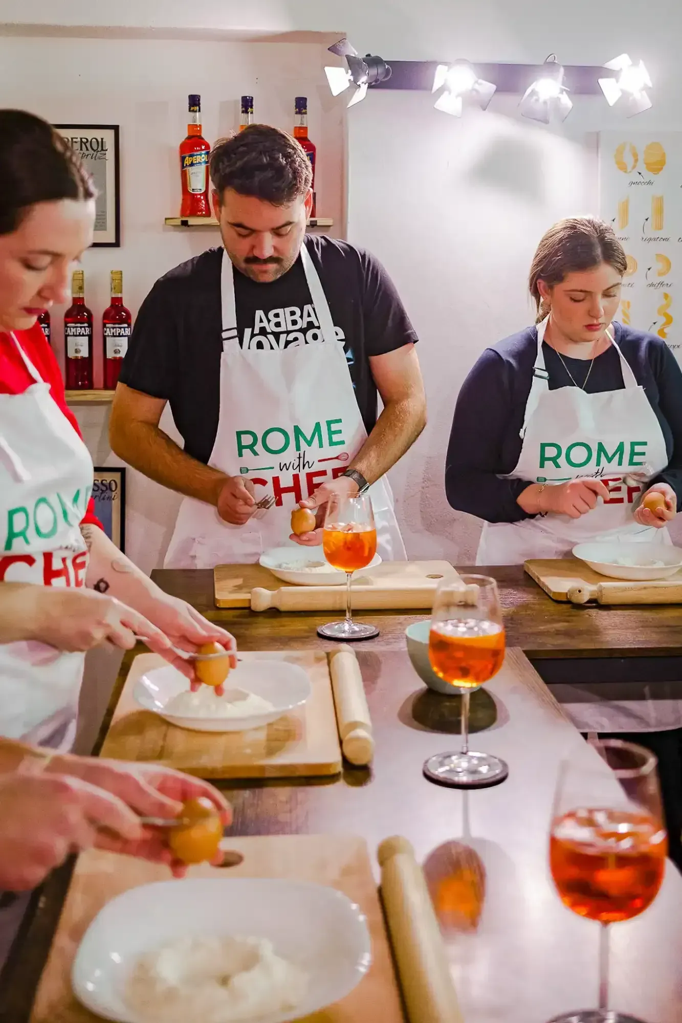 Hands-on pasta preparation during interactive Spritz & Spaghetti cooking class