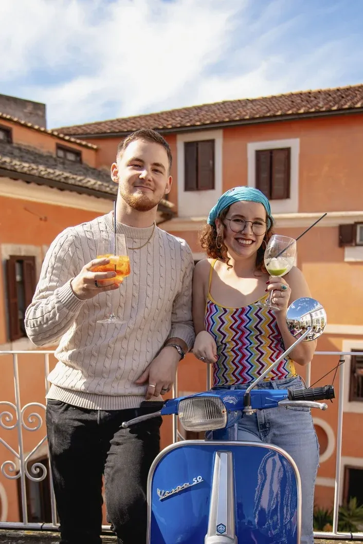 Couple enjoying aperitivo at a rooftop bar. Photo from our Rome Tipsy Tour