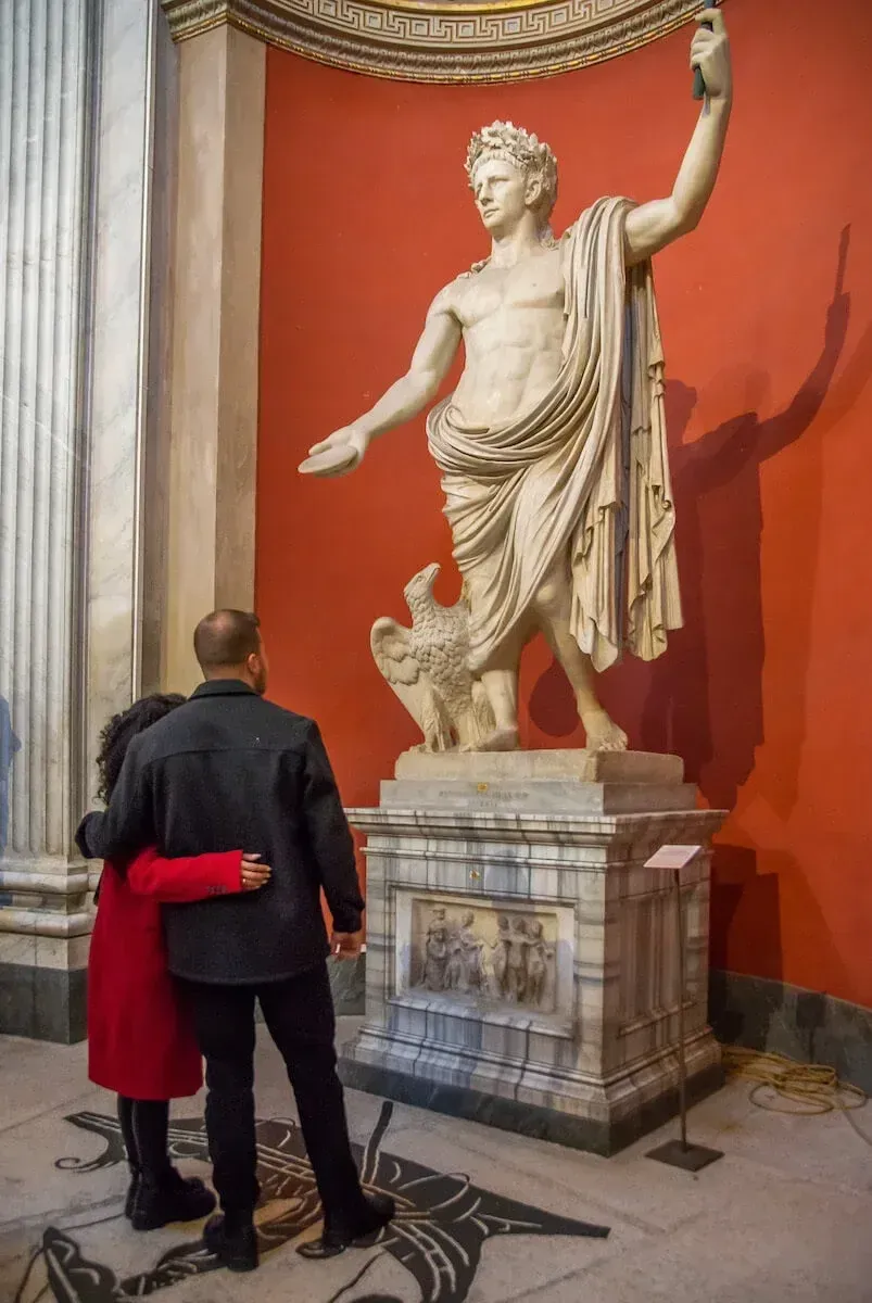 Ancient Roman sculptures and classical statues displayed in Vatican Museums gallery